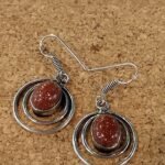 Brinco Prateado com Aros e  Pedra do Sol